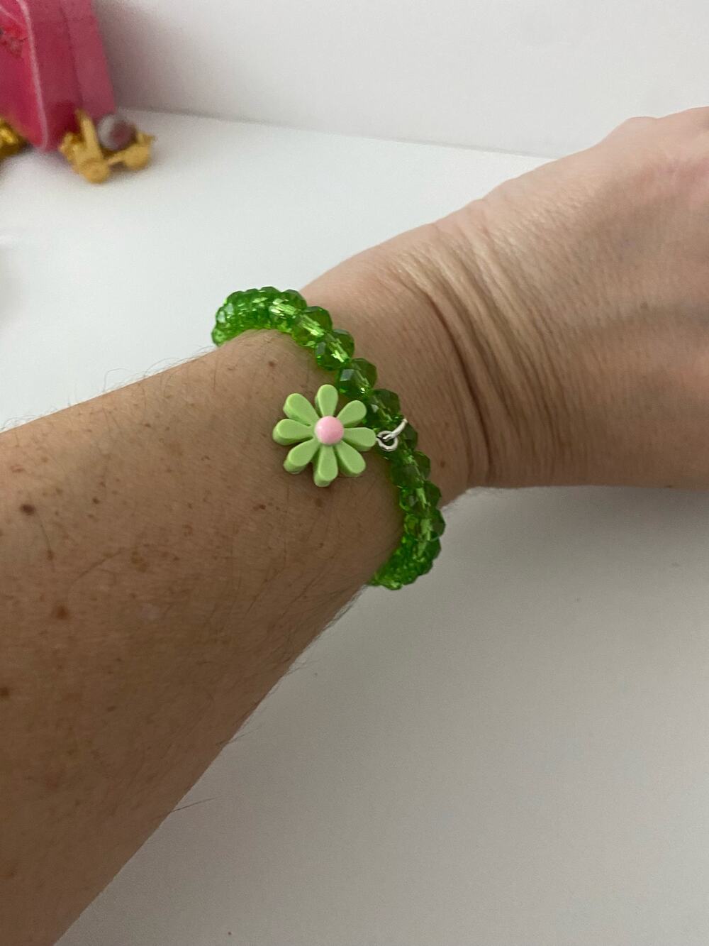 glass bead bracelet with daisy charm